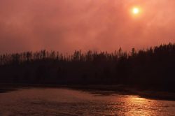 Smokey sunset along Madison River Photo