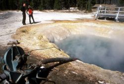 Siphon being used to clean Morning Glory Pool Image