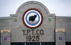 Yellowstone Park Transportation Company logo on concessioners' building in Gardiner, Montana Image
