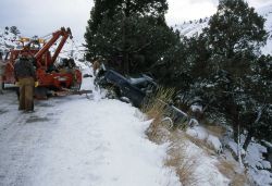 YPSS (Yellowstone Park Service Stations) tow truck pulling a pickup out of the Gardner River Image
