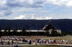 Crowd at Old Faithful Geyser with Old Faithful Inn in the background Image