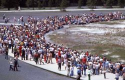 Crowd on foor near Old Faithful geyser Image